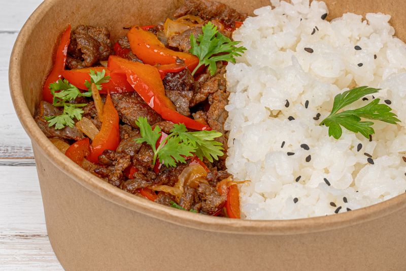 Korean BBQ beef bowl with kimchi and rice
